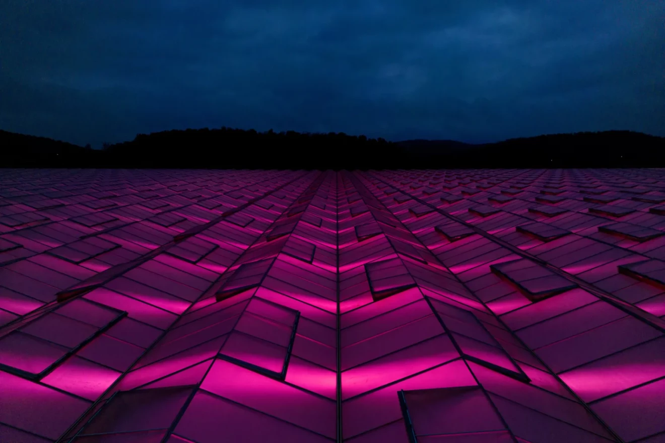 Lights glow through the exterior of AppHarvest’s Somerset greenhouse.